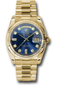 A rolex date just with gold president bank, gold bezel and blue face.
